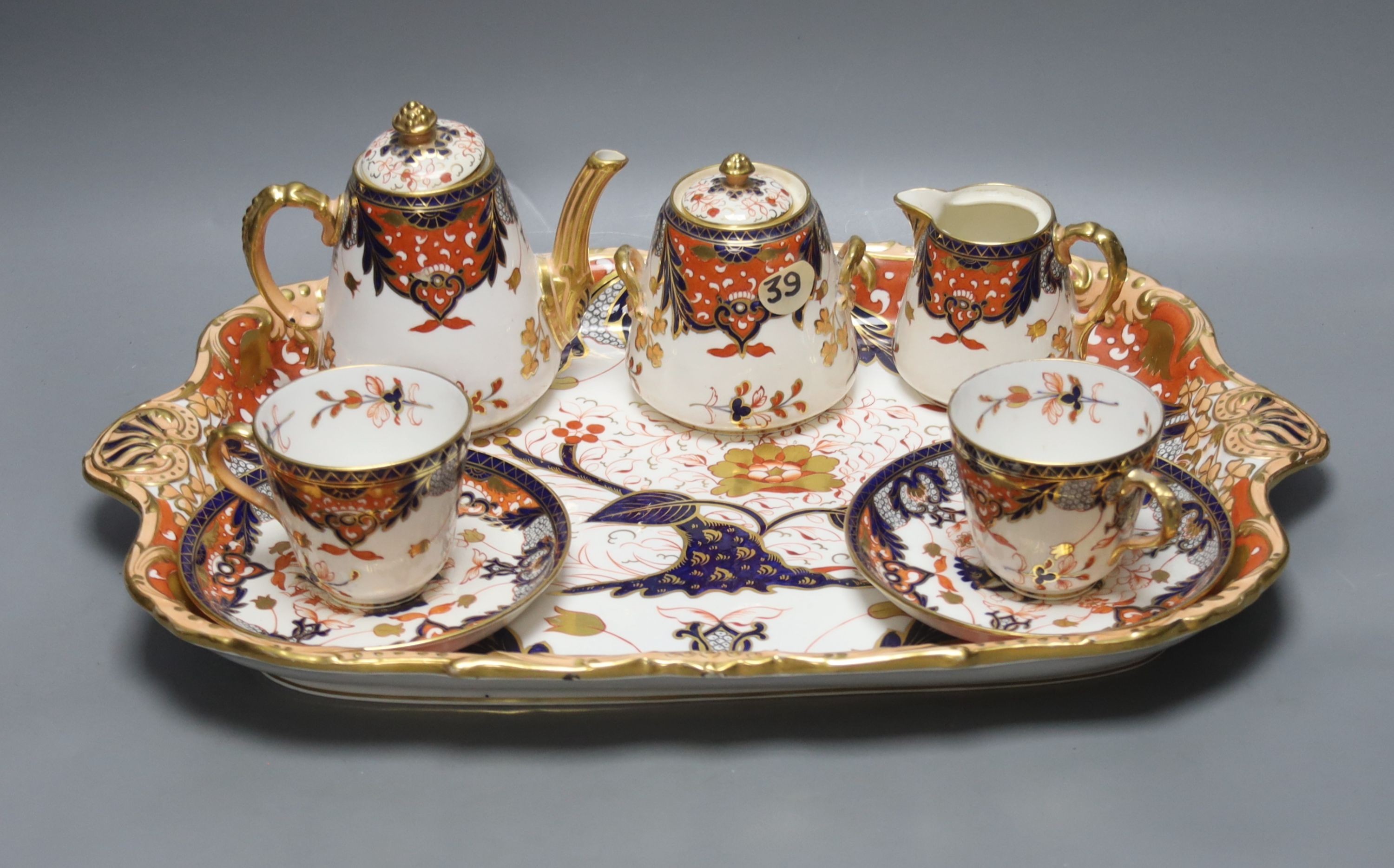 A Davenport Imari pattern tete a tete cabaret set, tray width 46cm